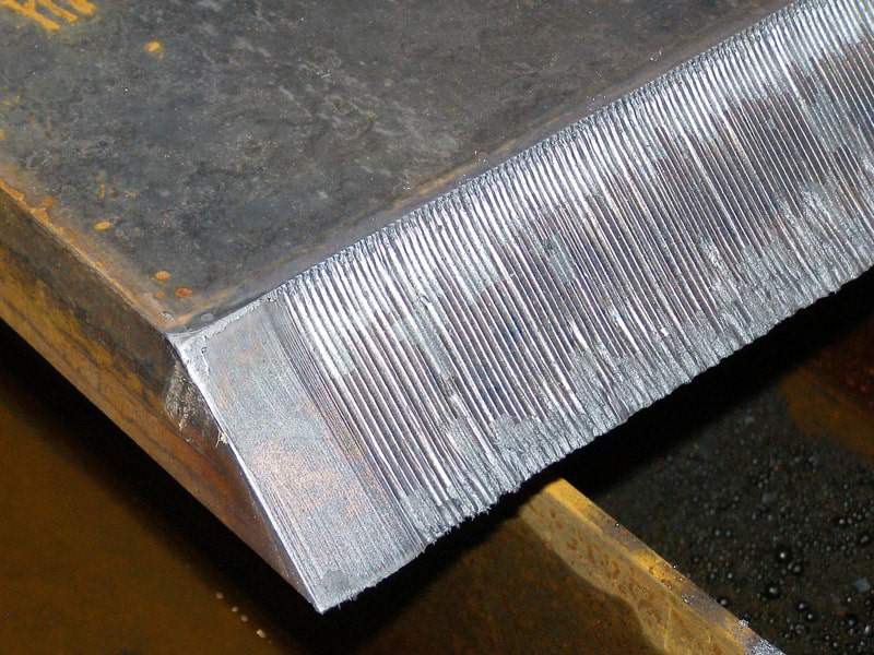 Attempted 45-degree bevel where the first �- � inches of the bevel is smooth while the rest shows repeated vertical gouges in the cut surface.